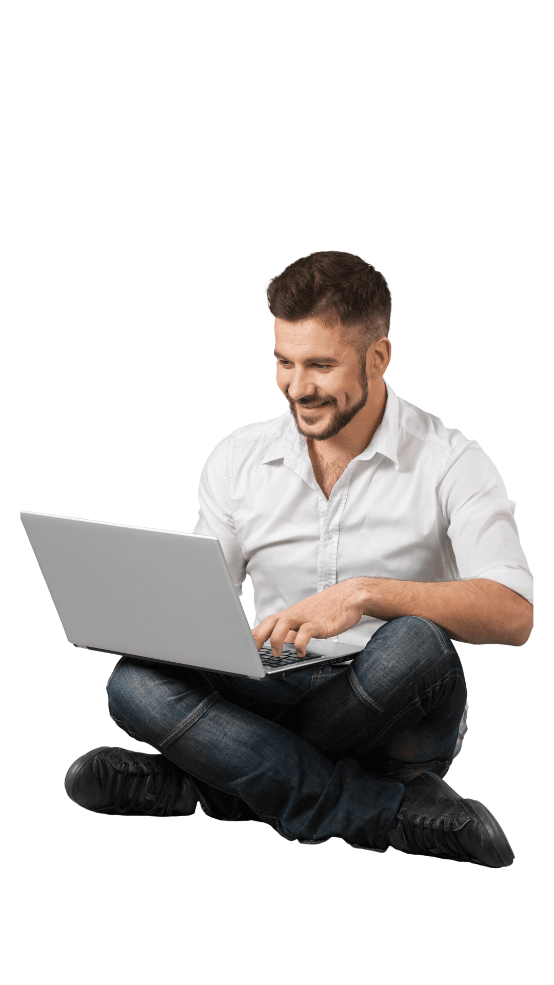 Man sitting down on the floor looking at information in the computer