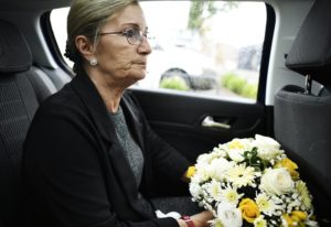 Sad widow on the way to th funeral