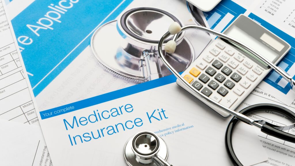 Medicare health insurance documents and a stethoscope.